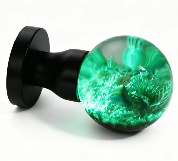 Micro-Landscape Resin Door Handle with Cyan Illumination Micro-Landscape Resin Door Handle Emitting Cyan Light, with a Brass Base Featuring a Black Circle