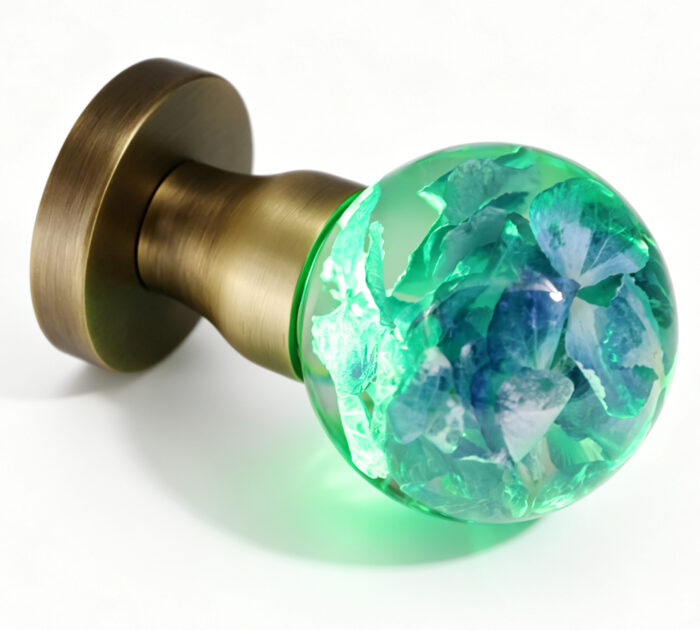 Hydrangea Resin Door Knob with Cyan Illumination Handcrafted Hydrangea Resin Door Knob Emitting a Cyan Glow, Mounted on a Round, Copper-Toned Brass Base