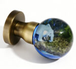 Elephant-Themed Resin Door Knob with Blue Illumination, Mounted on a Round, Copper-Toned Brass Base