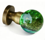 Elephant-Themed Resin Door Knob with Green Illumination, Mounted on a Round, Copper-Toned Brass Base