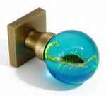 Resin Door Knob with Embedded Scorpion and Cyan Illumination, Mounted on a Square, Bronze-Toned Brass Base