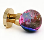 Elephant-Themed Resin Door Knob Emitting Pink Light, Mounted on a Round Gold Brass Base