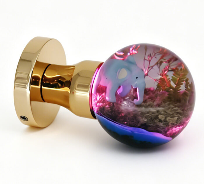 Elephant-Themed Resin Door Handle with Pink Illumination Elephant-Themed Resin Door Knob Emitting Pink Light, Mounted on a Round Gold Brass Base