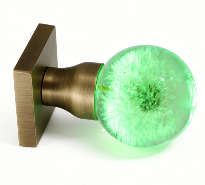 Dandelion Resin Door Handle with Cyan Illumination — 1 Dandelion Resin Door Knob Emitting Cyan Light, Mounted on a Square, Copper-Toned Brass Base