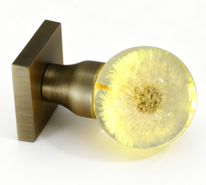 Dandelion Resin Door Handle with Warm Yellow Illumination Dandelion Resin Door Handle Emitting Yellow Light, with an Antique Bronze Square Base