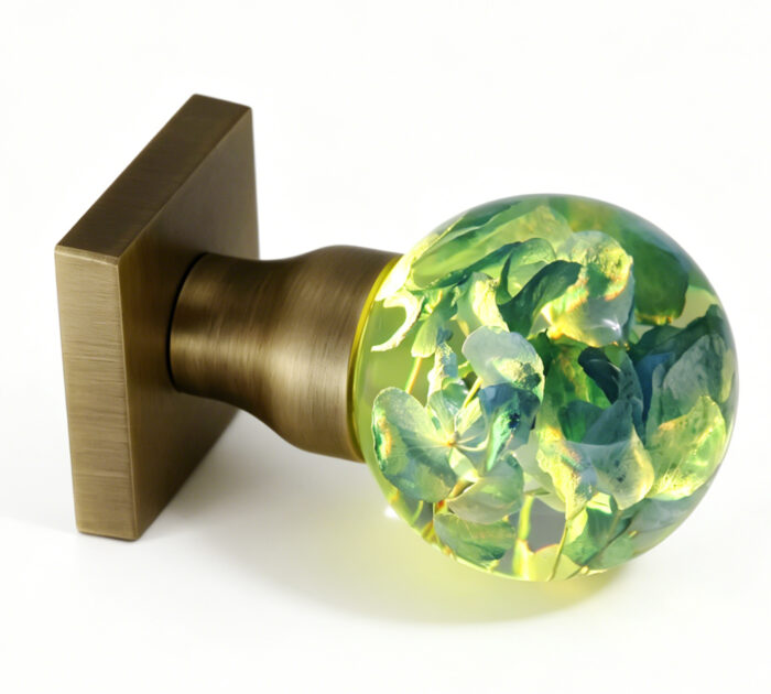 Hydrangea Resin Door Knob with Warm Yellow Lighting Handcrafted Hydrangea Resin Door Knob Emitting a Warm Yellow Glow, with an Antique Bronze Square Base